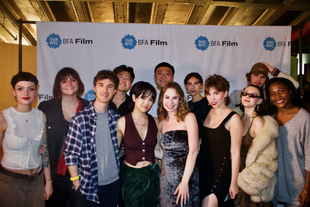 Maura with SVA classmates in front of the BFA Film step and repeat at the end of year thesis showcase held at the SVA Theatre